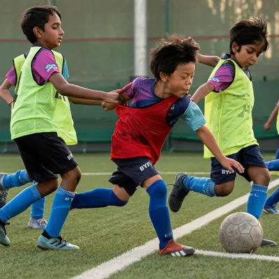 The excitement is real as our young players get into the action. This drill focuses on agility and teamwork, with kids learning to navigate the field together in a fun and competitive spirit.