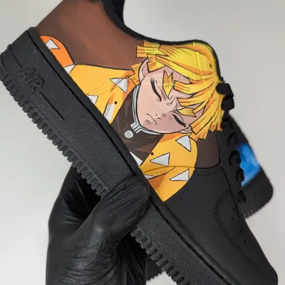 A close-up of Zenitsu from Demon Slayer in his powerful Thunder Breathing First Form. I painted this on a black Air Force 1 to make the yellow and orange pop.