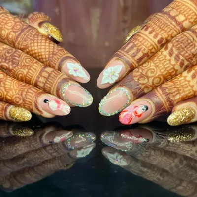 The ultimate bridal manicure. This set, shown against beautiful henna, features incredibly detailed hand-painted art, 3D flowers, and glitter, creating a truly one-of-a-kind look for a bride's special day.