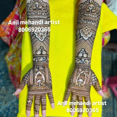 A beautiful and symmetrical design featuring palace windows (jharokhas) and peacock motifs. The fine line work and dense patterns are perfect for a full bridal look.
