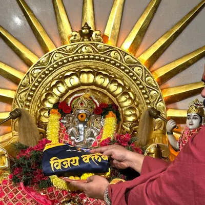Seeking blessings at the start of a new year. Our club jersey being offered at the temple.