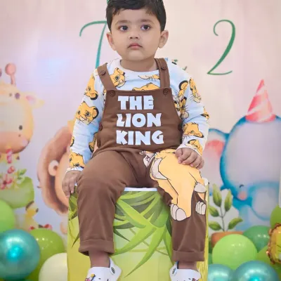 A handsome little boy in his 'The Lion King' themed outfit for his second birthday shoot.