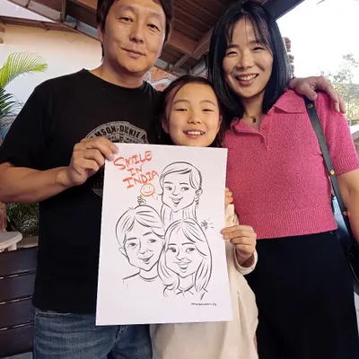 It was a pleasure to draw this happy Korean family. My art transcends language, bringing smiles to people from all over the world. "Smile in India" indeed!