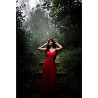 The color version of my misty forest series. The vibrant red dress stands out against the deep greens of the woods, creating a powerful, fairytale-like image that feels both mysterious and beautiful.