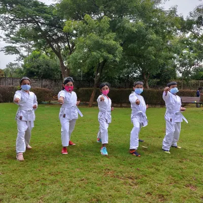 Here is my group practicing their stances together during an outdoor karate camp session. The green grass and open space provide a wonderful change of scenery and energy for the kids.