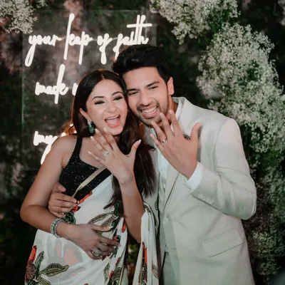 A joyous shot of singer Armaan Malik and influencer Aashna Shroff showing off their rings right after their engagement. It was an honor to capture the start of their forever journey.