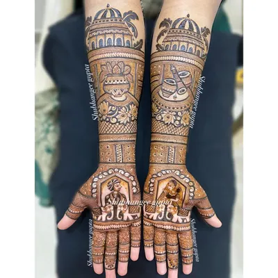 A full view of a classic bridal mehndi design. I included bride and groom portraits, elephants for good luck, and architectural domes on the forearms. Every part of this design is filled with detail.
