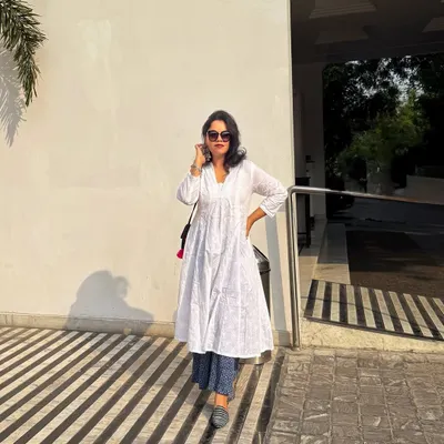 Grace and confidence in a classic white kurta layered over printed palazzo pants. I guide clients on styling ethnic and fusion wear that feels authentic and looks polished.
