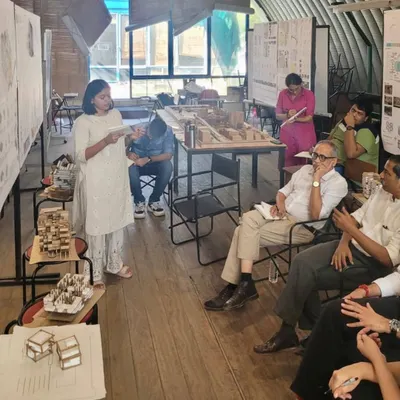 A student presents her work during a final design review at CEPT University. These reviews are intense, critical dialogues that push students to clarify their thinking and strengthen their architectural proposals.