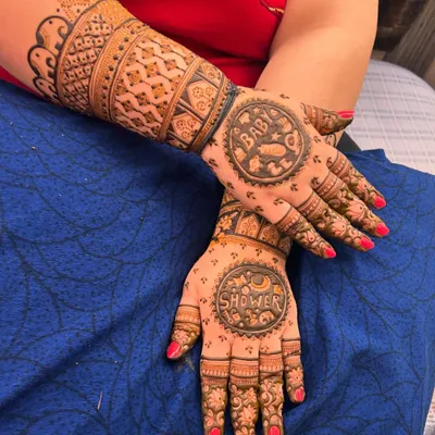 This custom baby shower mehndi is one of my favorites. I incorporated circular panels with "Baby" and "Shower" text, surrounded by tiny, cute motifs like rattles, feeding bottles, and little animals to celebrate the mom to be.