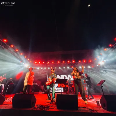 A wide shot of the entire band on a massive stage, surrounded by an impressive light show. This is the scale of production and energy we bring to large open-air concerts and festivals.