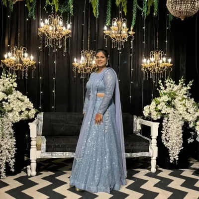 Ready for the sangeet night! This stunning powder blue lehenga, fully adorned with sequins, is designed to catch the light as you dance the night away.