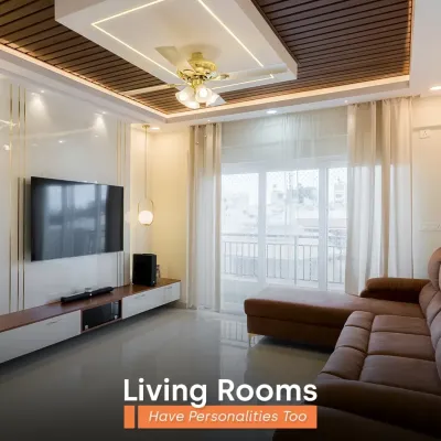 Your living room has a personality, and we help you express it. This bright and airy space features a stunning wooden-paneled false ceiling and a comfortable leather sofa, perfect for a modern, luxurious feel.