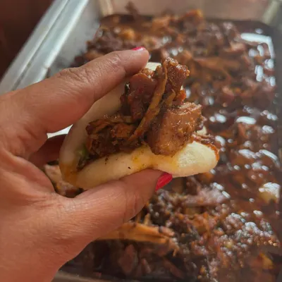 Our tender pulled pork stuffed into a soft, fluffy bao bun. It's a perfect bite-sized snack that combines our slow-cooked meat with a popular Asian-inspired preparation.
