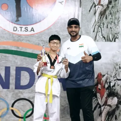 A proud moment with one of my champions from the DTSA team. His trophy and medal are a testament to his hard work at the Siri Fort Sports Complex competition.