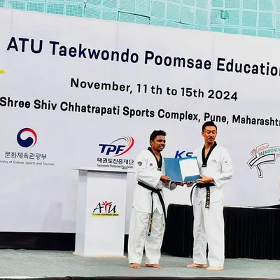 Receiving my certificate at the ATU Taekwondo Poomsae Education event in Pune. This was an important step in my own development, allowing me to bring world-class coaching techniques and a deeper understanding of Poomsae back to our academy and students.