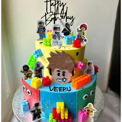 A block party on a cake! This vibrant two-tier Lego-themed cake was so much fun to build, with edible blocks and character toppers for the birthday boy.