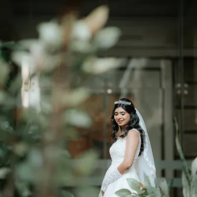 A candid moment of our stunning Catholic bride. We created a soft, dewy look that she had dreamed of, ensuring she glowed with natural radiance.