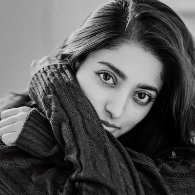 A simple, stunning black and white portrait. The close crop and direct gaze create an intimate and powerful image that focuses entirely on expression.