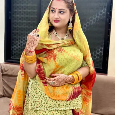 A beautiful customer looking radiant in her traditional attire, complete with our jhumkas and hand ring.