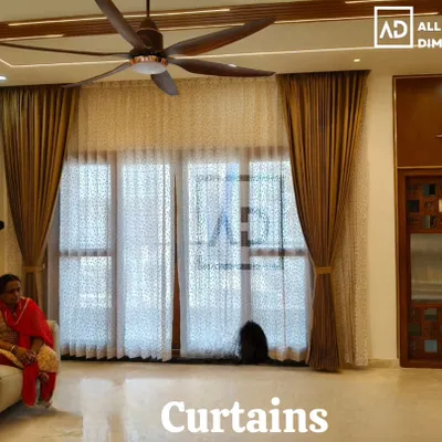 This is the kind of transformation I love to see. Here, I installed a double rod system with delicate sheer curtains for daytime privacy and heavy, elegant blackout curtains for complete light control in a beautiful living room.