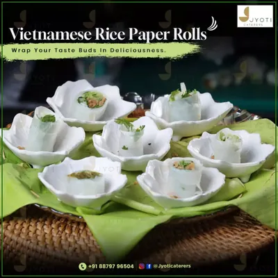 Delicate Vietnamese rice paper rolls, filled with fresh ingredients and served in elegant, flower-shaped ceramic bowls for a light and healthy appetizer.