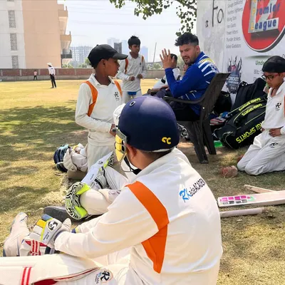 Coaching continues even during the match. Here, one of our coaches provides tactical advice and encouragement to players during a break in an RPL game. These moments of mentorship are crucial for development.