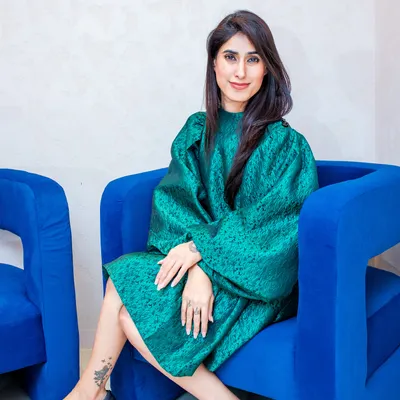 Here I am in a structured emerald green dress, demonstrating how a bold color and a strong silhouette can create a powerful and elegant look. The black pumps keep it classic and grounded.