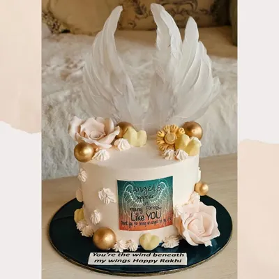 A truly special custom cake for Rakhi with delicate angel wings and a heartfelt message. This design is for celebrating the sibling who is your guardian angel.