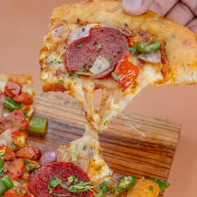 The perfect cheese pull isn't an accident. We shot this pepperoni pizza for Khameera, using specific lighting and angles to capture that irresistible, gooey texture that makes customers crave a slice.