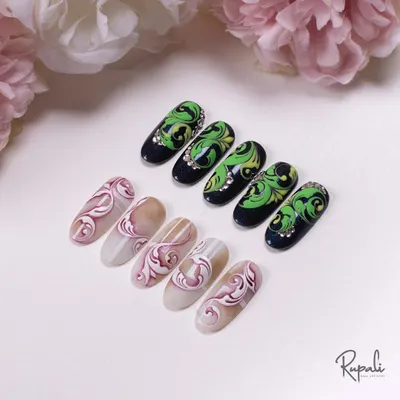 This image shows two different styles of complex swirls. On the left, a subtle tone-on-tone effect, and on the right, a high-contrast design with crystal accents.