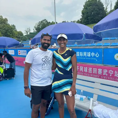 Celebrating a championship win at the W50 Wuning tournament. I am here with our athlete Rutuja Bhosale and her partner Paige Hourigan after they secured the doubles title.