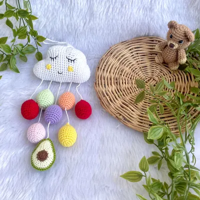 This sleepy cloud wall hanging is one of my cutest nursery decor items. It features colorful "raindrops" and a customer requested a mini avocado, which was a fun addition.