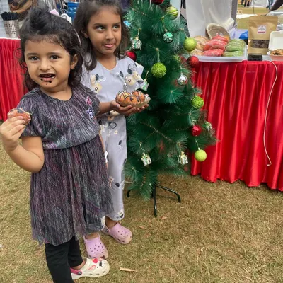Two of my cutest little clients enjoying some chocolatey treats at a Christmas market. Their happy faces say it all.