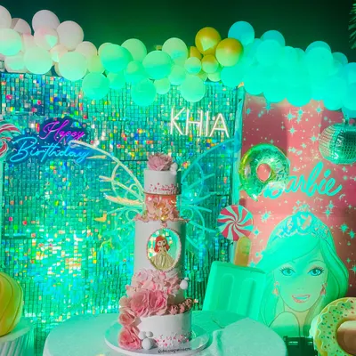 A full view of the 5-tier masterpiece I designed from scratch for a client who wanted something huge, fancy, and pink. This cake features multiple textures, a custom portrait, and a cascade of handmade sugar flowers.