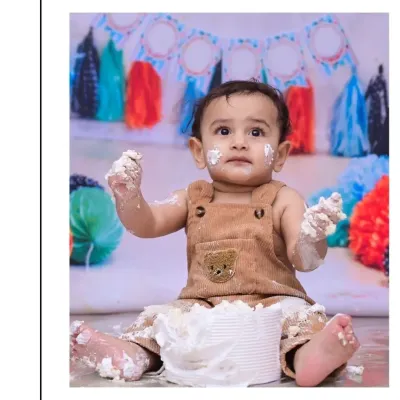 With frosting on his hands and face, this little one is fully embracing his first cake smash. I focus on capturing these authentic, messy moments of discovery and delight.