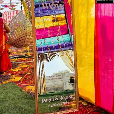 A fun and interactive detail for a Haldi ceremony. I created this personalized mirror with the couple's name and a trendy "So Looking Like a Wow" quote for guests to take selfies with.