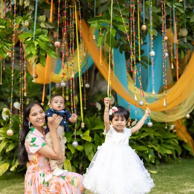 A beautiful family moment captured in our musical garden. The hanging beaded bells and colorful drapes created a perfect sensory playground for the little ones to explore and enjoy.
