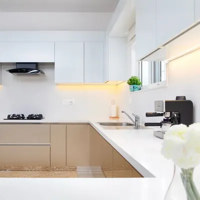 There’s something magical about how warm tones and crisp whites come together in a kitchen. The soft glow from the under-cabinet lights is perfect for early mornings. This is everyday luxury.