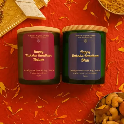 My special Raksha Bandhan collection, featuring 'Happy Raksha Bandhan Behen' and 'Happy Raksha Bandhan Bhai' candles. They are perfect for celebrating this beautiful bond, shown here in a festive setting with traditional sweets.