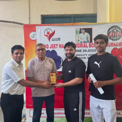 Receiving a token of appreciation at the 2nd Jeet Maan Memorial Boxing Tournament. It is an honor to contribute to the sport and host these events.