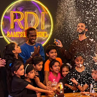 Pure joy and celebration. This moment from our Children's Day party, complete with a snow spray surprise, perfectly captures the fun-loving spirit of our studio. We believe in creating happy memories.