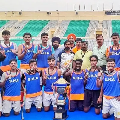 The moment of triumph. My team celebrating their first position victory in the NHA Cup 2022 in New Delhi, holding the championship trophy high.