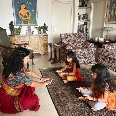 Teaching the foundational 'tattadavu' sitting posture to my youngest students. We focus on correct posture and alignment from the very beginning, ensuring a strong base for their dance education in a gentle and encouraging way.