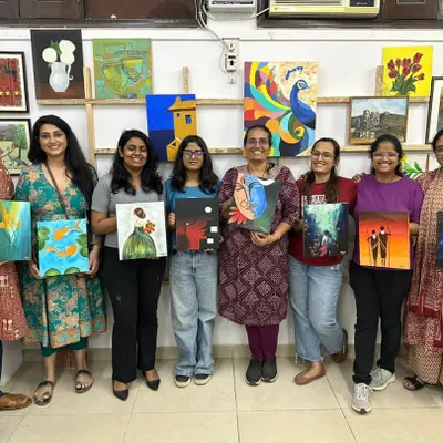 A group of doctors from AIIMS proudly displaying the diverse artworks they created during our acrylic painting workshop. Art is a powerful tool for relaxation and team bonding.