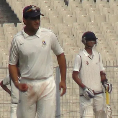 A memory from my professional career during the 2011-12 Ranji Trophy season. Here I am on the field at Eden Gardens during a Delhi vs Bengal match with the legendary Sourav Ganguly. This experience at the highest level of domestic cricket shapes the professional standards I bring to my coaching.