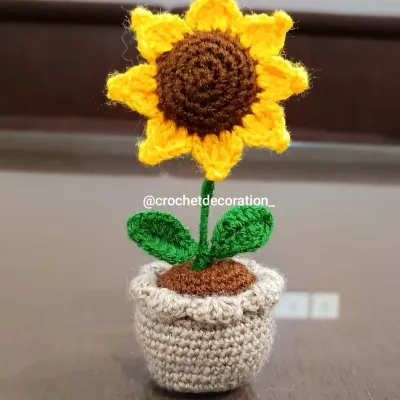 Our classic mini crochet sunflower in a light grey pot. This is one of our most popular items, perfect for adding a little sunshine to your workspace or car.