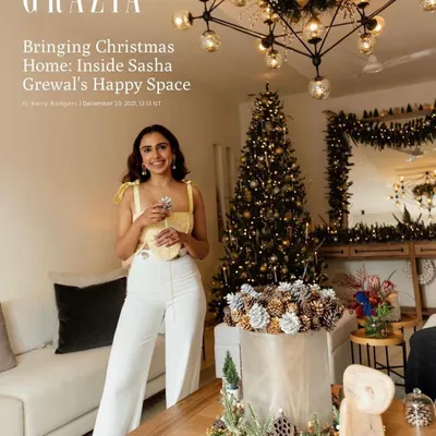 The cover story for Grazia India, featuring Sasha Grewal in her festively decorated home, capturing a warm and happy holiday atmosphere.