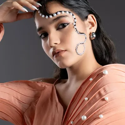 An editorial look created by our student for the JD Fashion Institute. This showcases their creativity with graphic elements and pearl embellishments for a high-fashion concept.