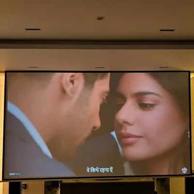 A close up of the 133 inch motorized screen in action. The picture quality from the ViewSonic 4K projector is so sharp and clear, it feels like you have a commercial cinema in your living room.